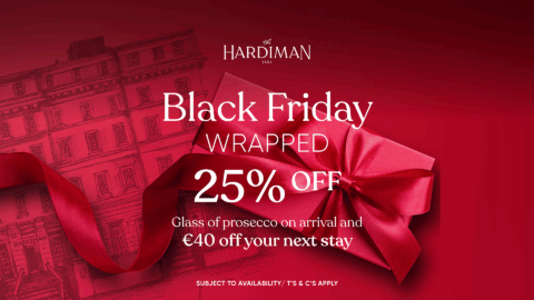 Red promotional image for The Hardiman hotel; text offers 25% off, a glass of Prosecco on arrival, and €40 off next stay for Black Friday.