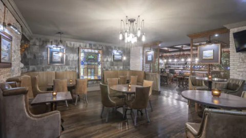 Cosy hotel lounge with plush seating, warm lighting, and a welcoming atmosphere, perfect for relaxing or socialising.